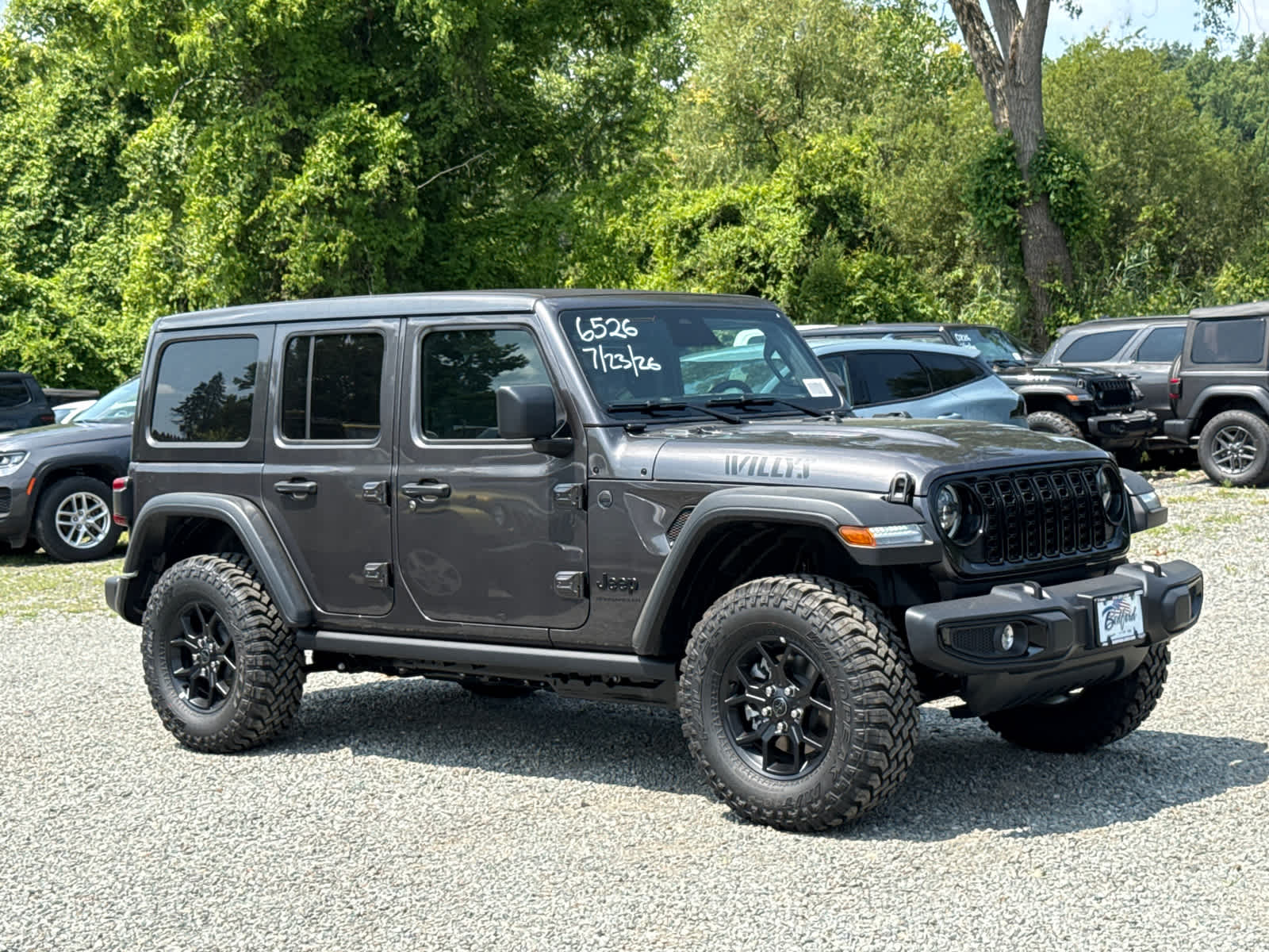 2026 Jeep Wrangler Willys in Granite Crystal Metallic Clearcoat — front three-quarter view