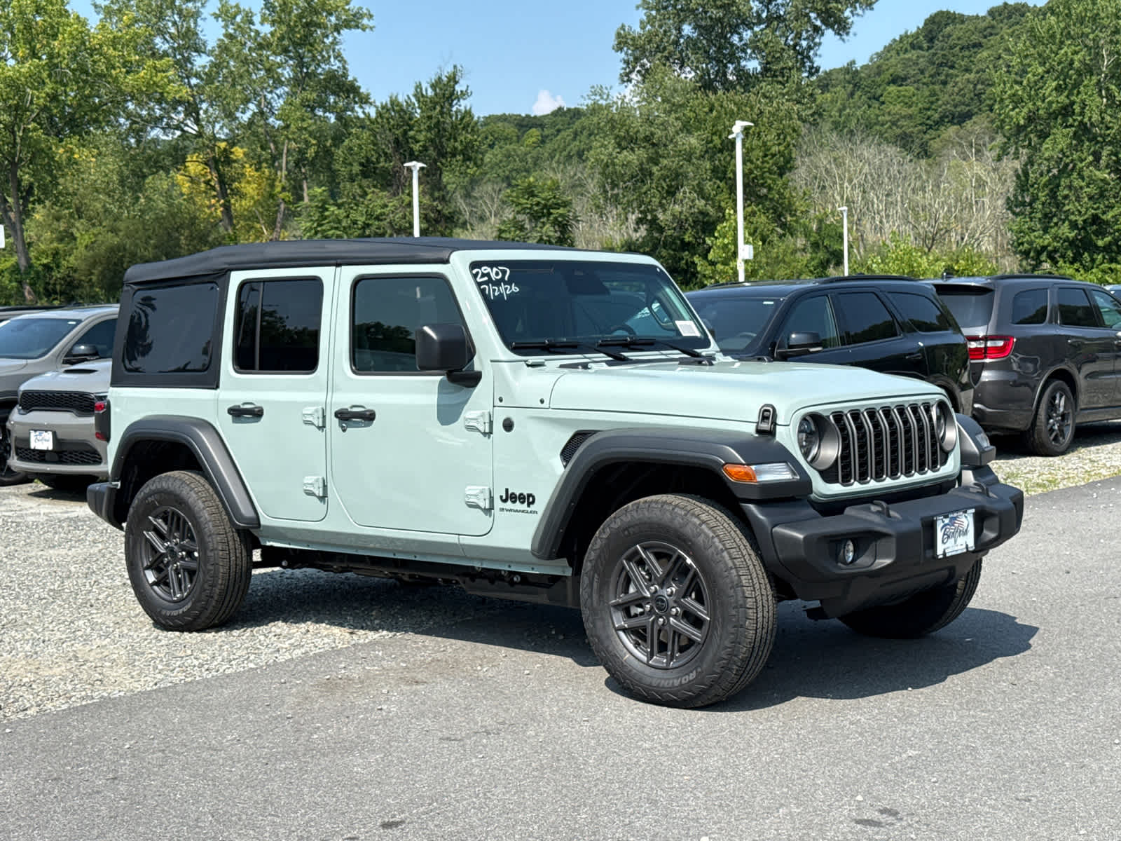 2026 Jeep Wrangler Sport S in Earl Clearcoat — front three-quarter view