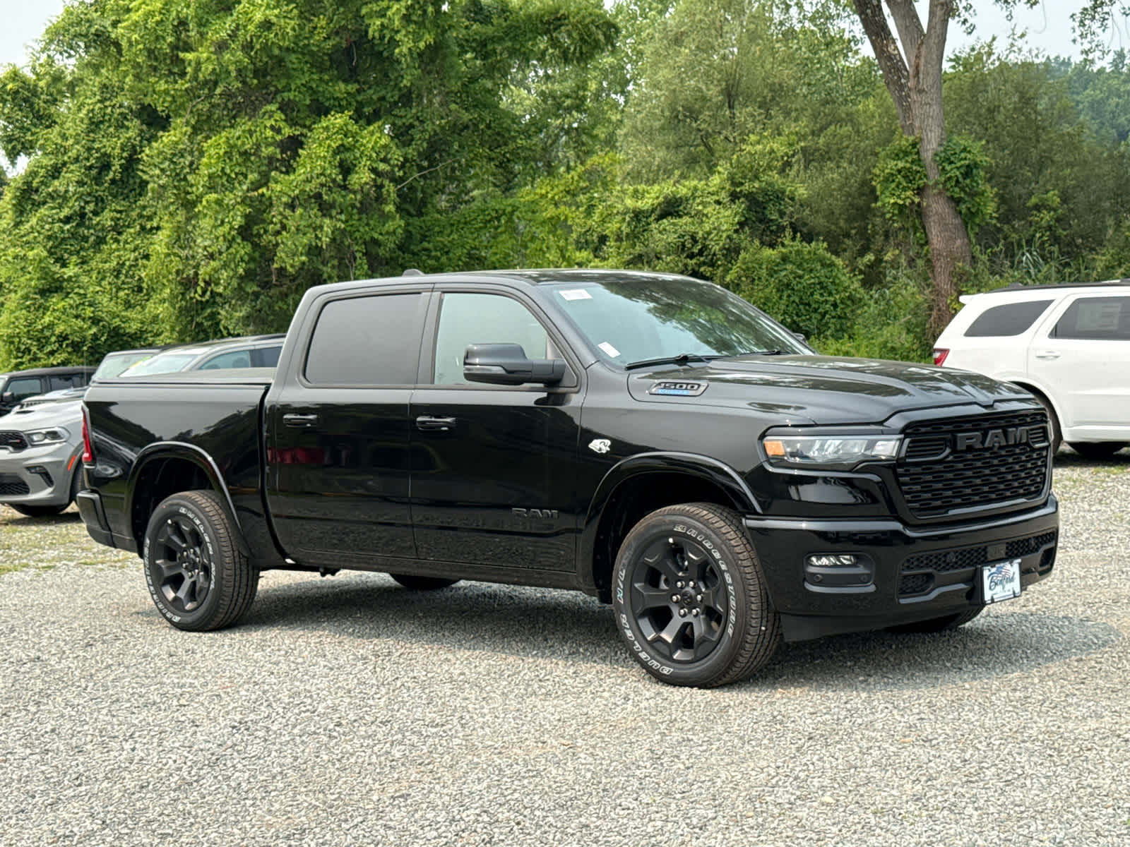 2026 RAM 1500 Big Horn in Diamond Black Crystal Pearlcoat — front three-quarter view
