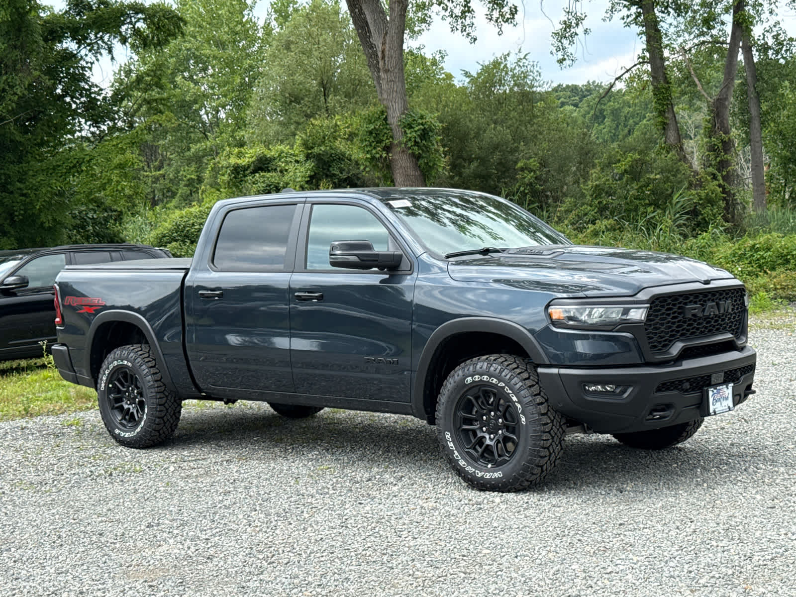 2026 RAM 1500 Rebel in Forged Blue Metallic — front three-quarter view